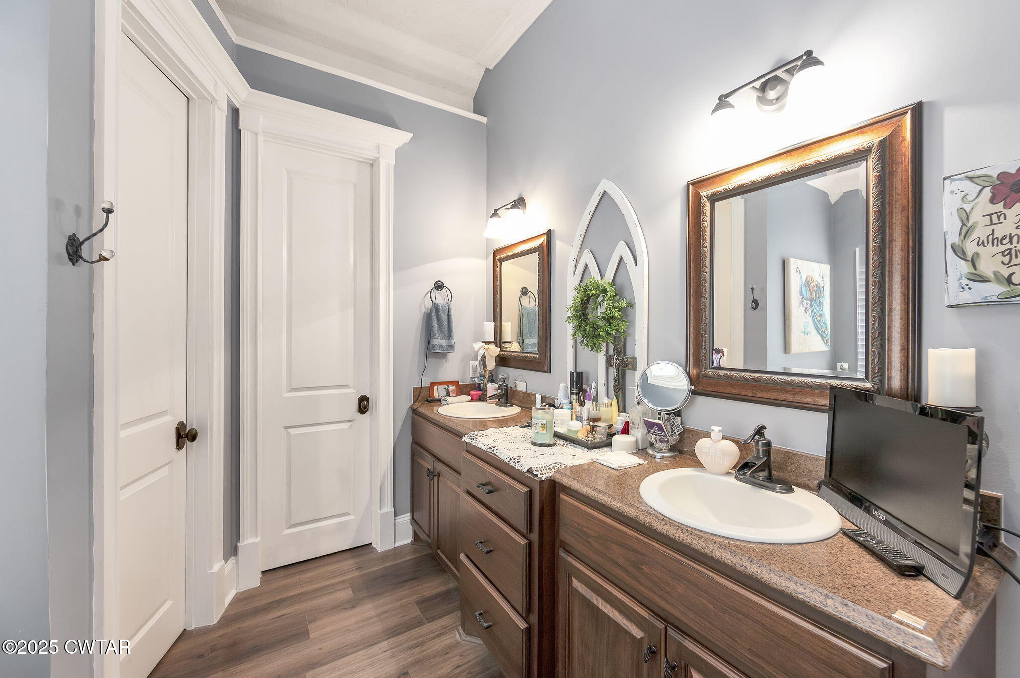 9 Dayton Cove Jackson, TN 38305 - Photo 22 of 27 a en suite bathroom with a double vanity sink and a mirror