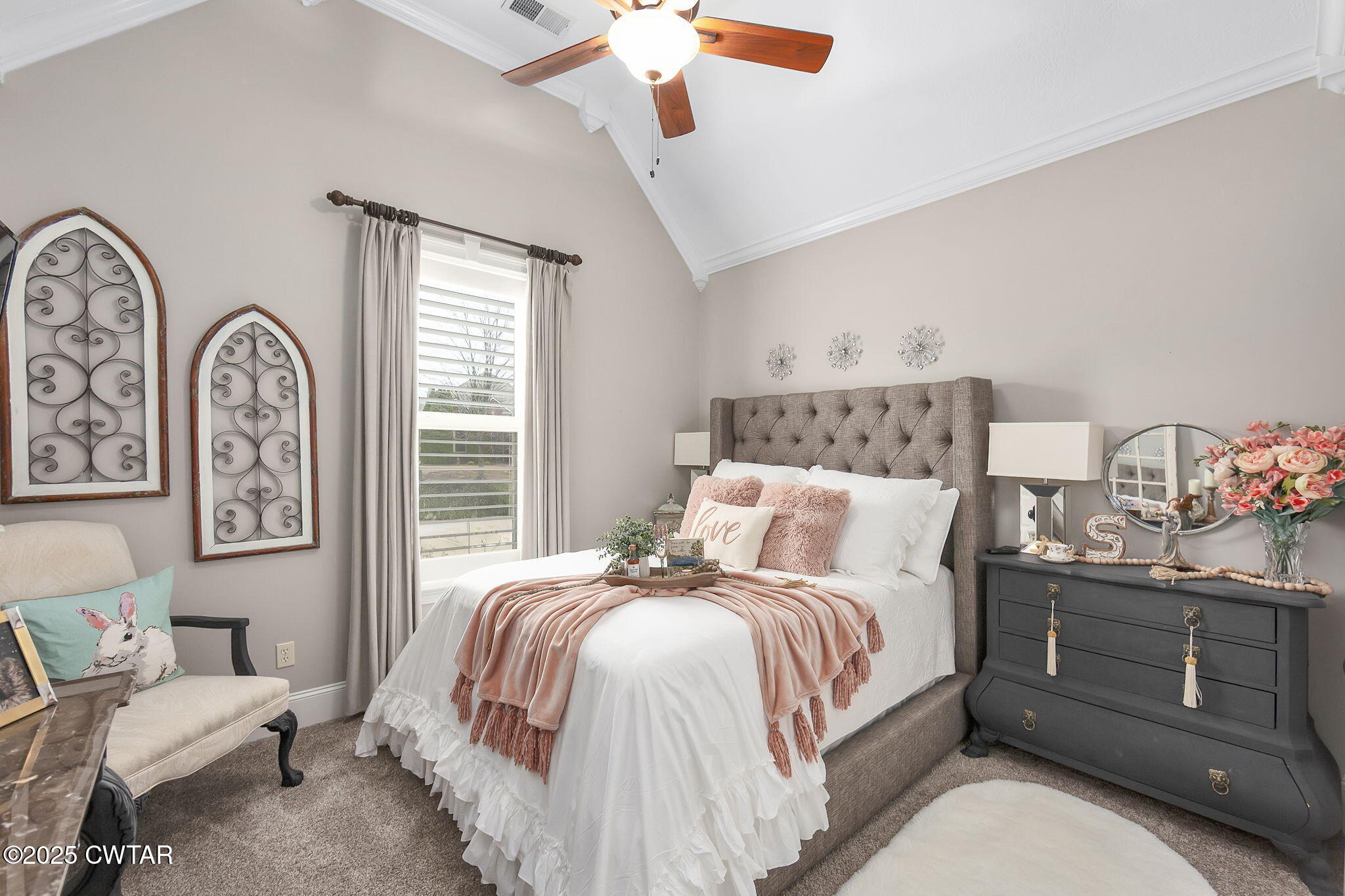 9 Dayton Cove Jackson, TN 38305 - Photo 24 of 27 a bedroom with a bed and a chandelier