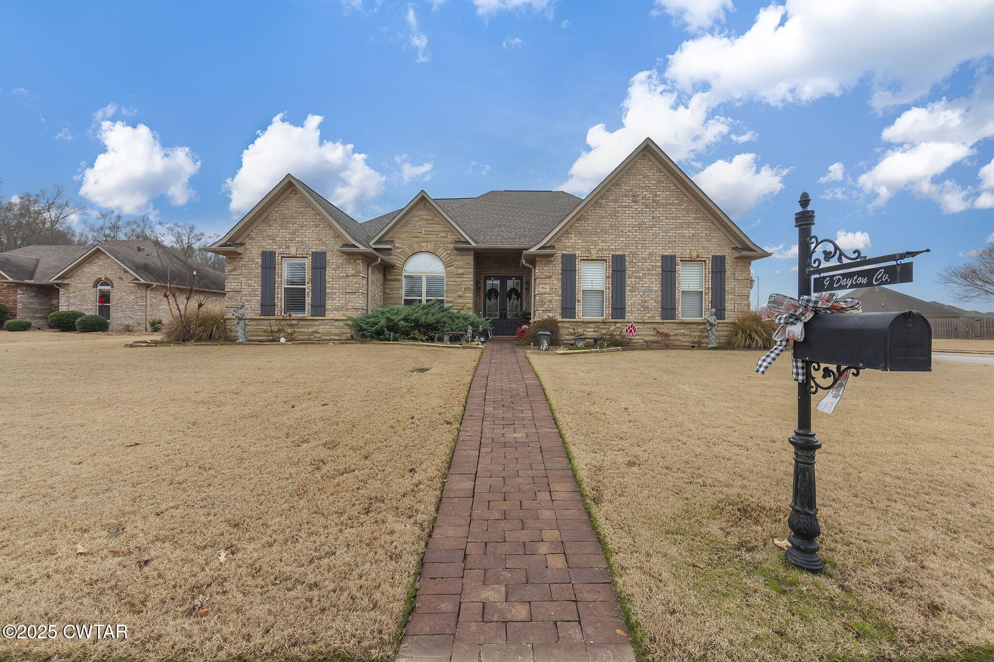9 Dayton Cove Jackson, TN 38305 - Photo 3 of 27 a front view of a house with a yard