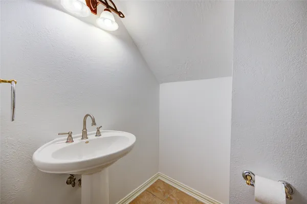 a bathroom with a sink and mirror
