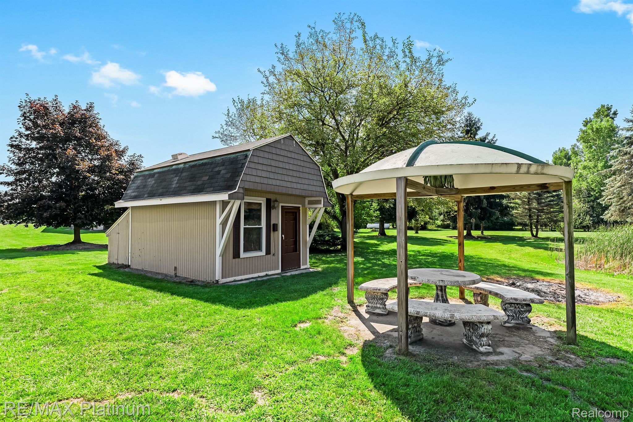 11733 North Fleming Road Fowlerville, MI 48836 - Photo 45 of 51 The Pond Clubhouse & Gazebo!