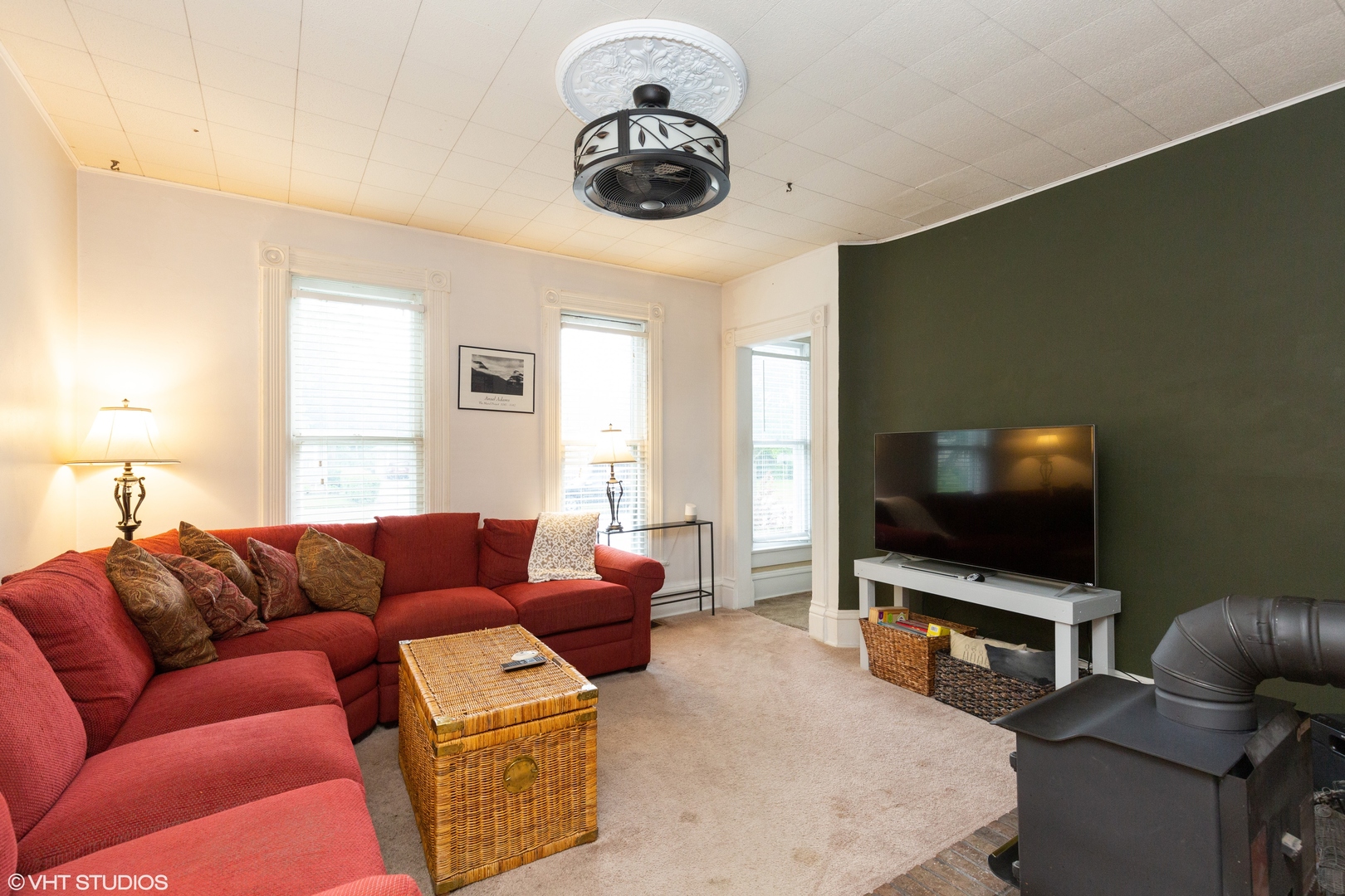 212 Lovell Street Elgin, IL 60120 - Photo 4 of 12 a living room with furniture and a flat screen tv