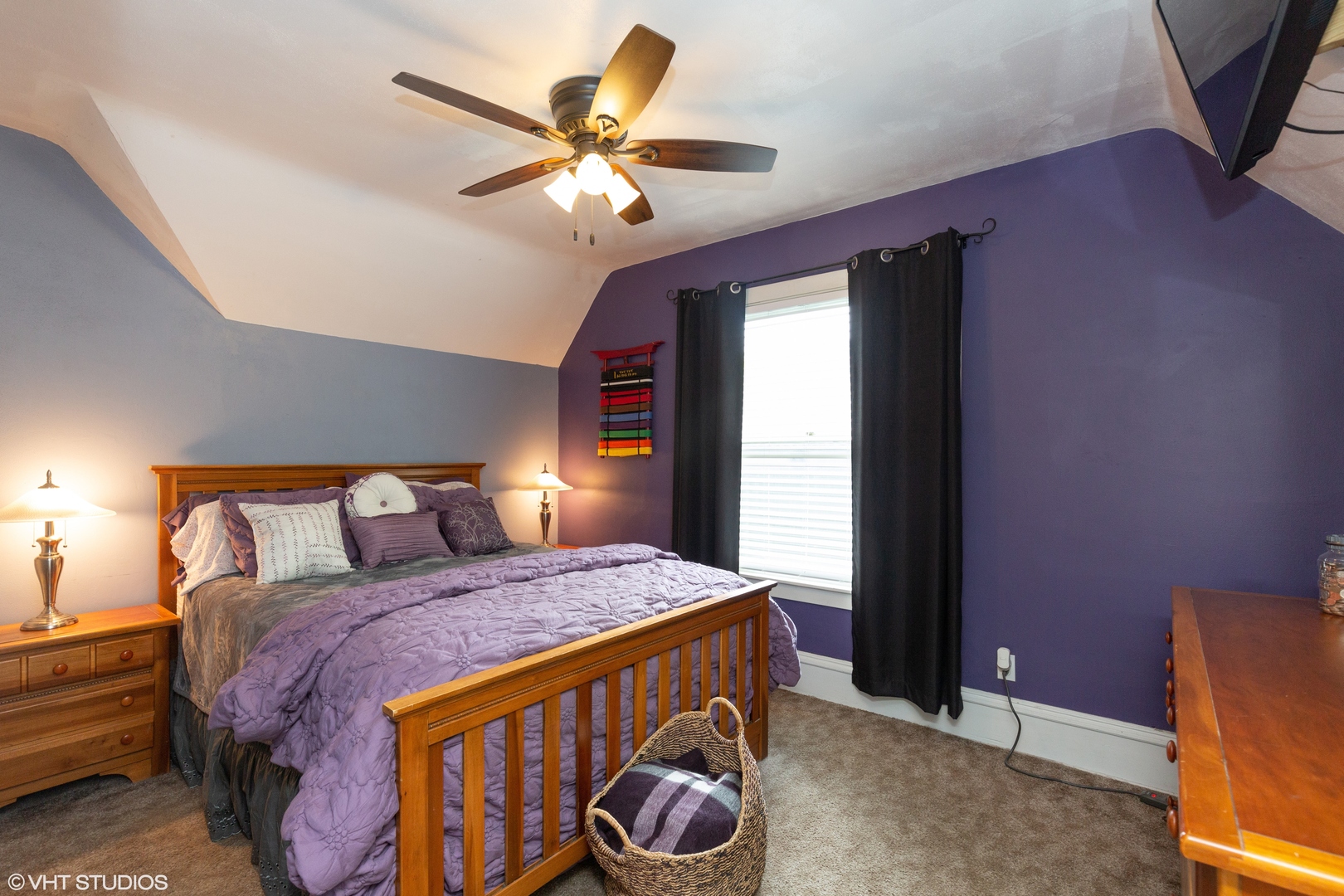 212 Lovell Street Elgin, IL 60120 - Photo 8 of 12 a bedroom with a bed and a chandelier