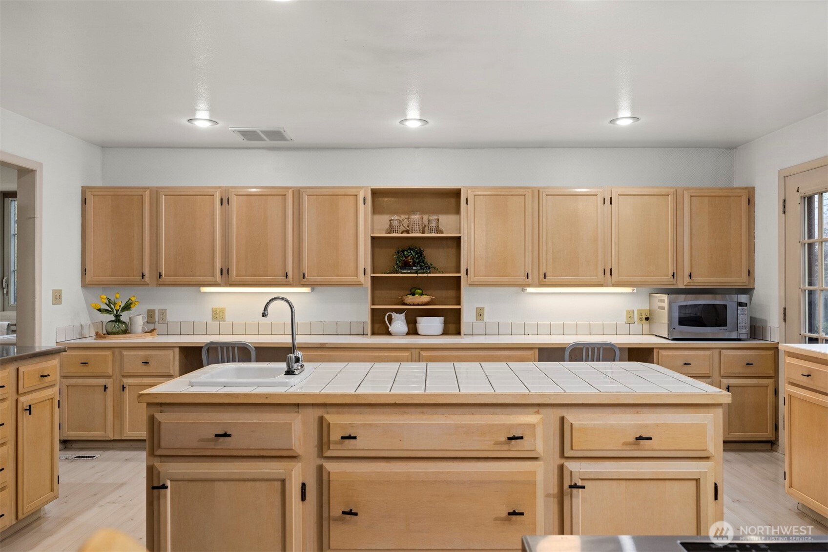 2935 King Street Bellingham, WA 98225 - Photo 13 of 38 a kitchen with a sink cabinets and window
