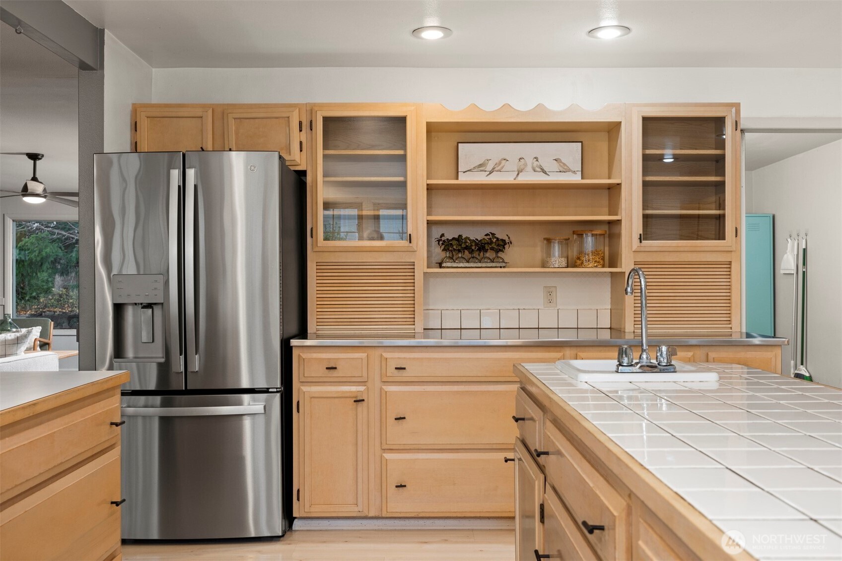 2935 King Street Bellingham, WA 98225 - Photo 15 of 38 a kitchen with stainless steel appliances a refrigerator and cabinets