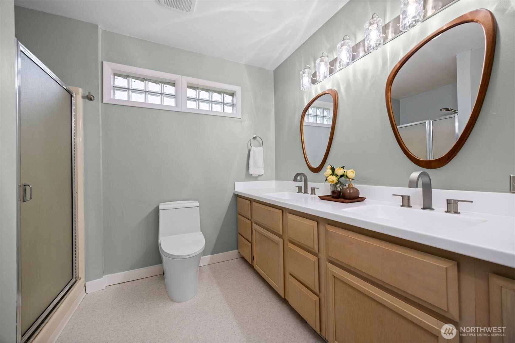 2935 King Street Bellingham, WA 98225 - Photo 20 of 38 a bathroom with a toilet sink and mirror