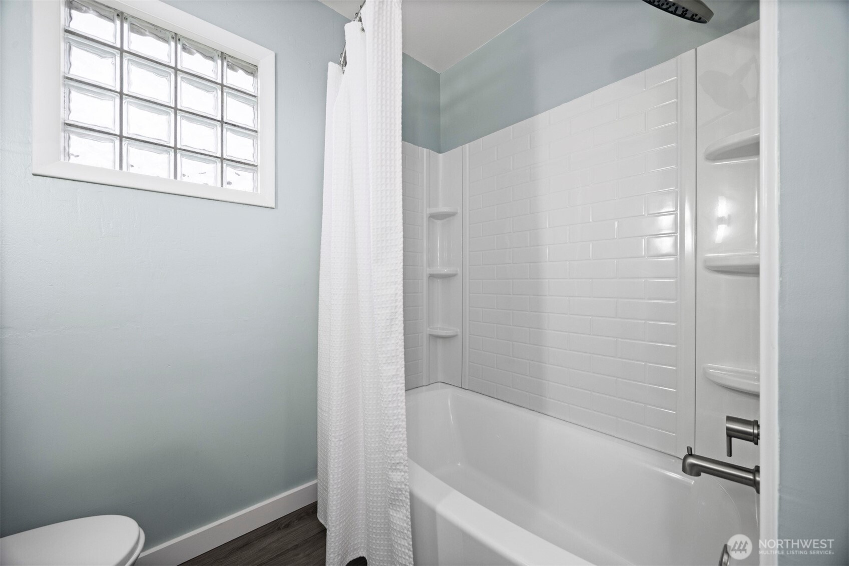2935 King Street Bellingham, WA 98225 - Photo 26 of 38 a bathroom with a bathtub and window