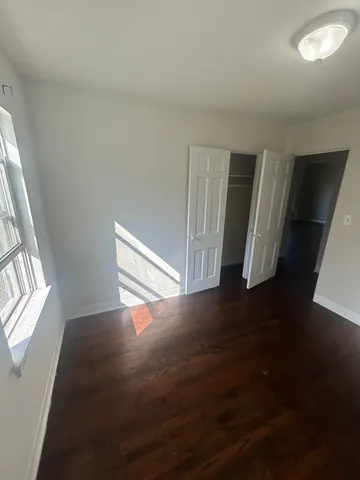 a kitchen with granite countertop a refrigerator a sink a stove a microwave a counter top and oven