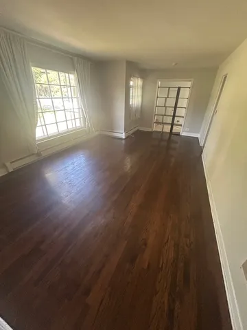 a kitchen with wooden floors and a stove
