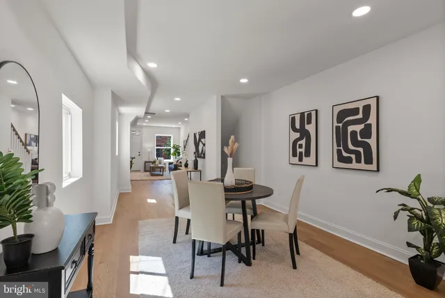 a kitchen with stainless steel appliances kitchen island granite countertop a refrigerator and a stove