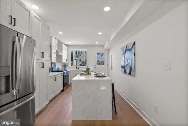 a bathroom with a bathtub and shower