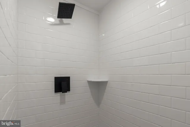 a bathroom with double sink and a mirror