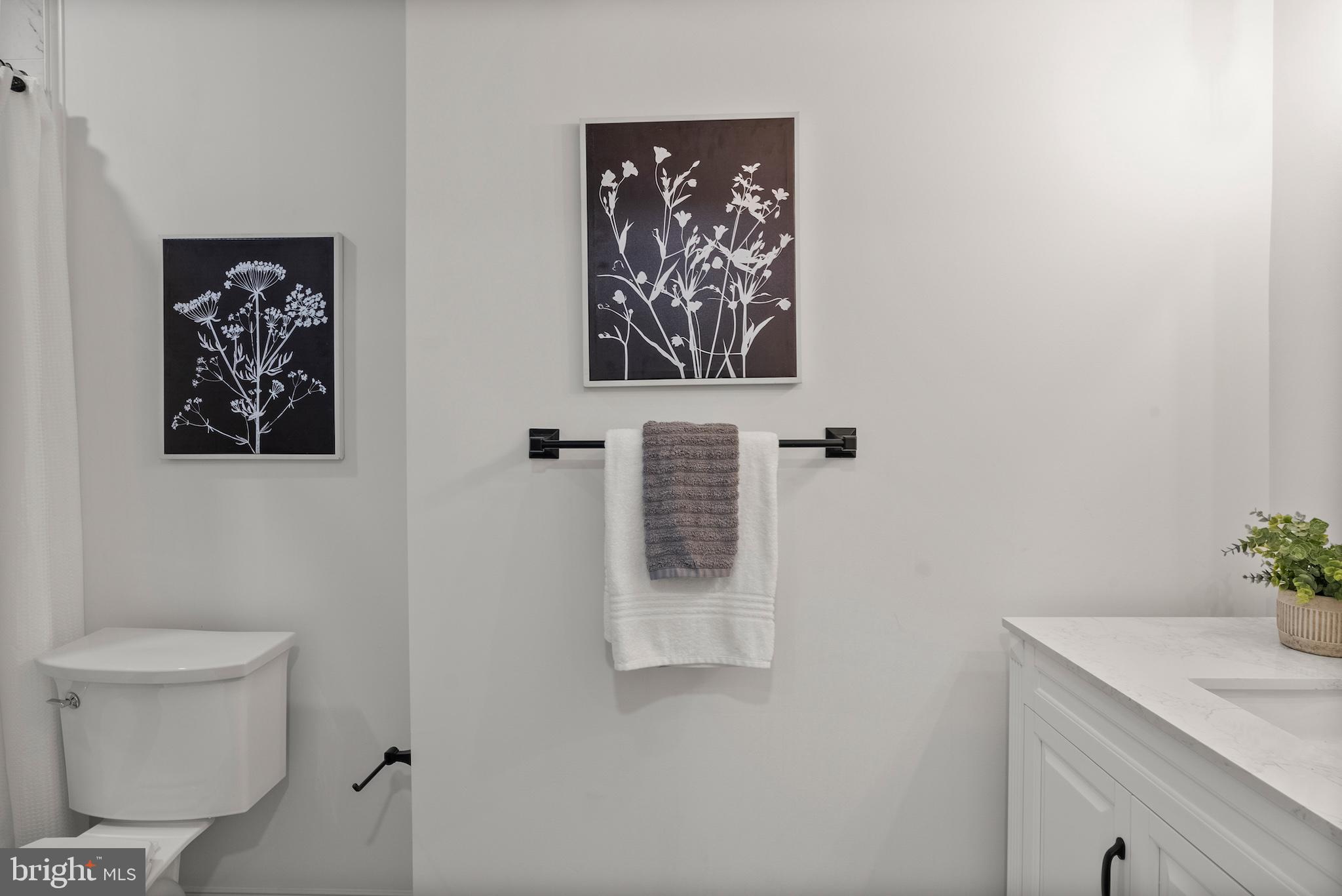 1523 Clarkson Street Baltimore, MD 21230 - Photo 28 of 57 a bathroom with a toilet and a sink