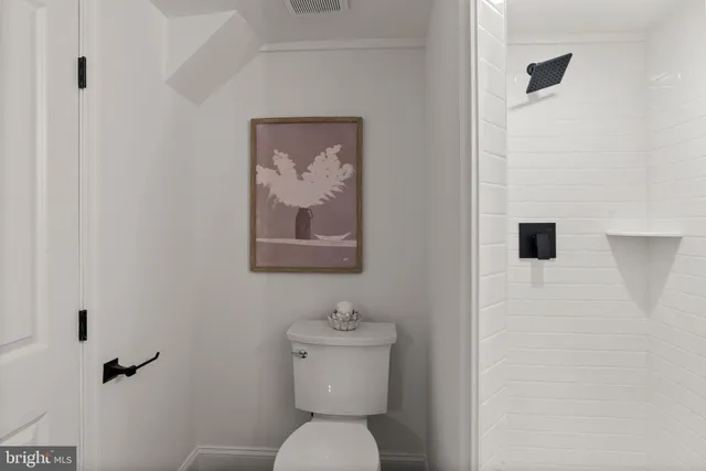 a bedroom with a bed and a lamp