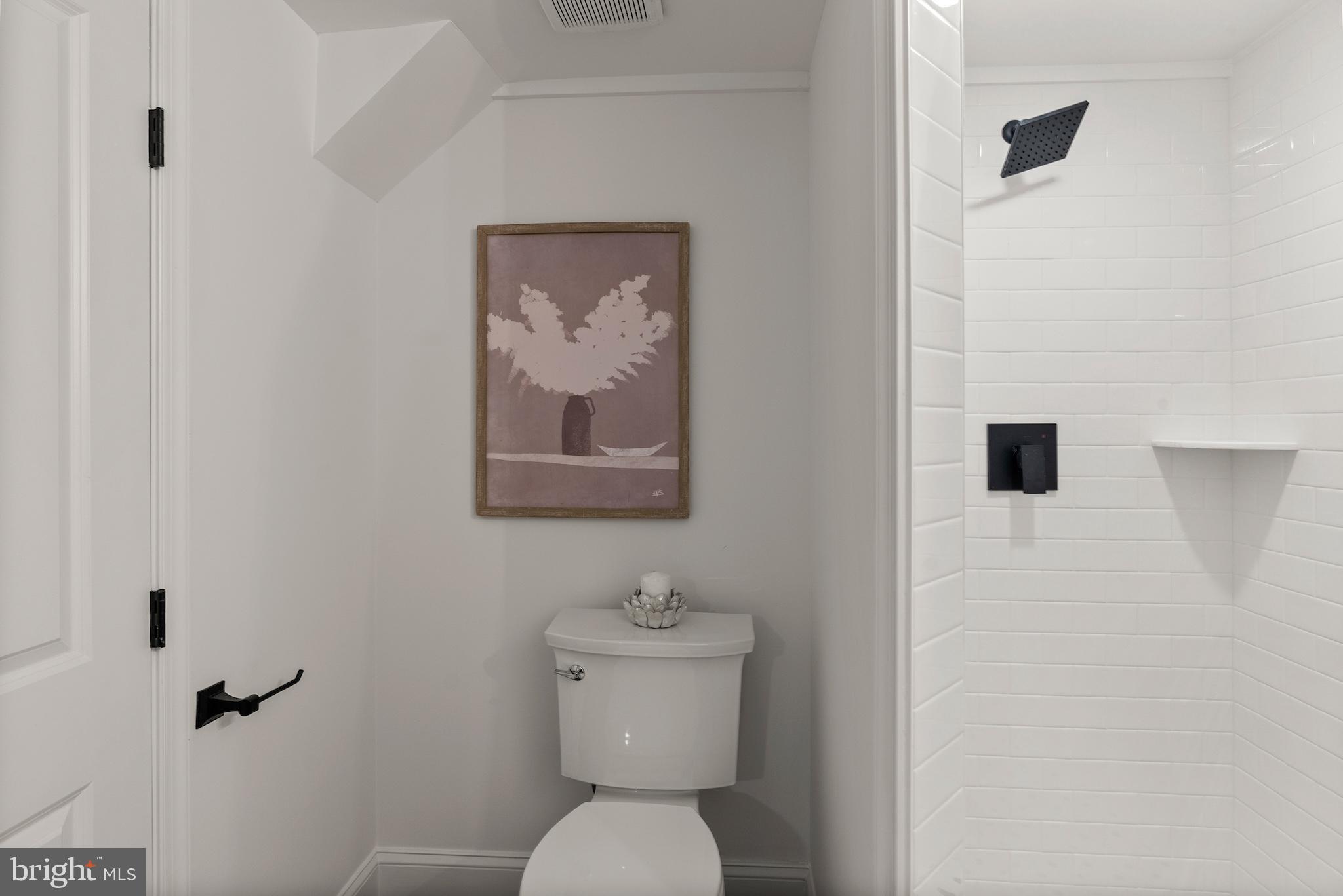 1523 Clarkson Street Baltimore, MD 21230 - Photo 35 of 57 a bathroom with a toilet and a sink