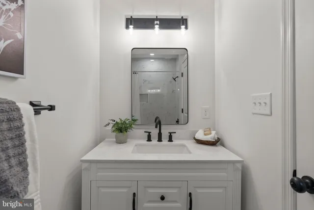 a bedroom with a bed and a lamp