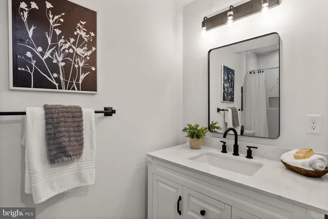 a bedroom with a bed and a lamp