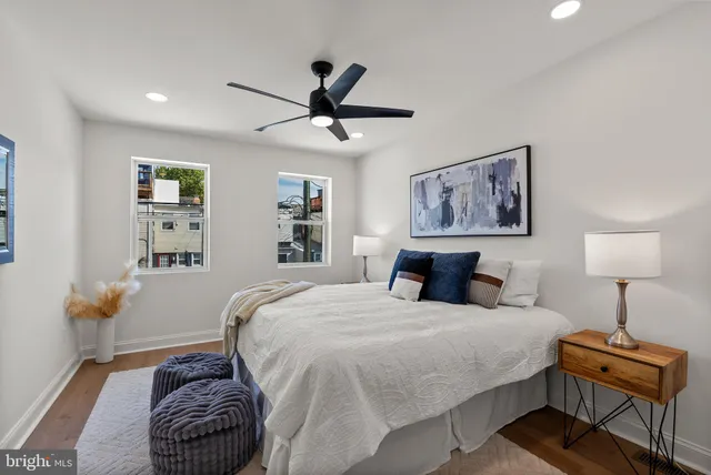 an empty room with a ceiling fan and carpet