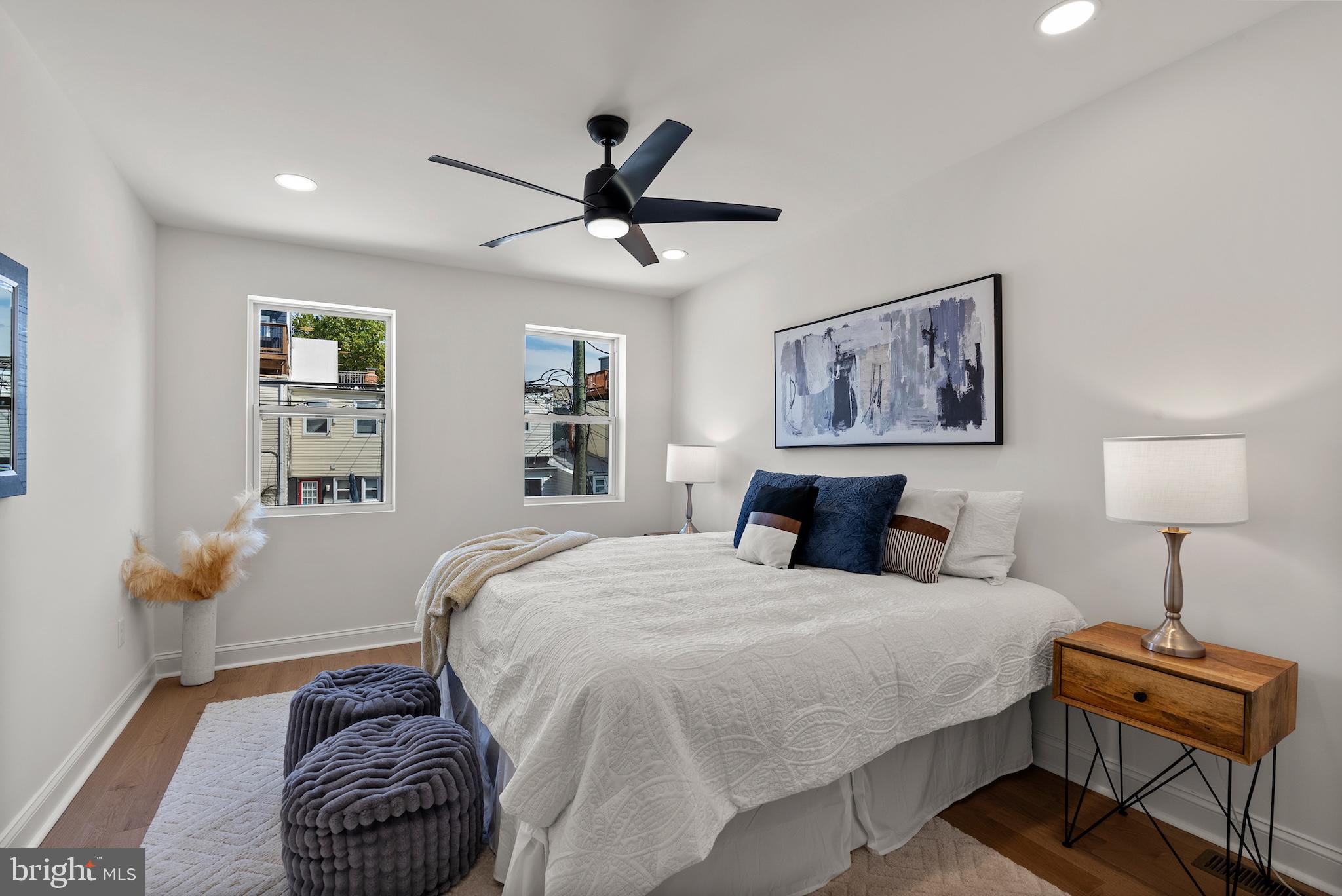 1523 Clarkson Street Baltimore, MD 21230 - Photo 39 of 57 a bedroom with a bed and a lamp