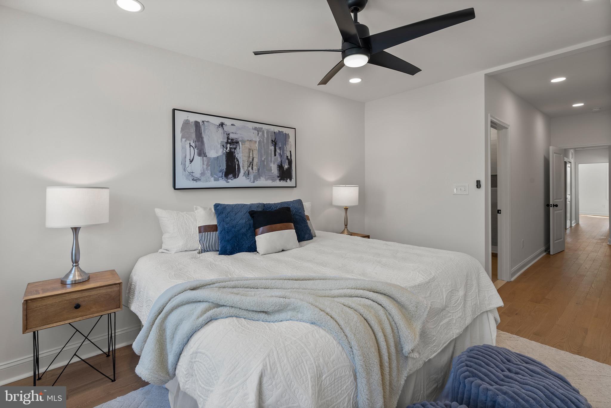 1523 Clarkson Street Baltimore, MD 21230 - Photo 40 of 57 a bedroom with a bed and a lamp