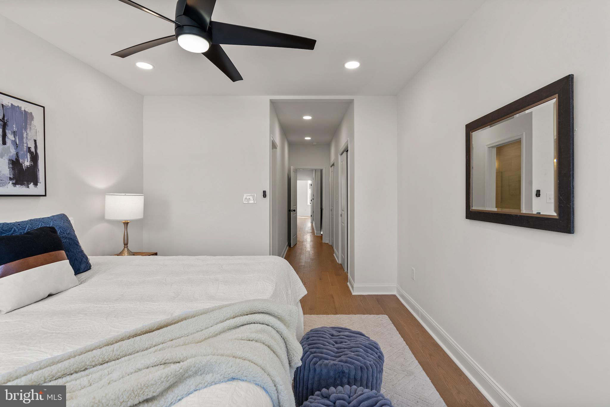 1523 Clarkson Street Baltimore, MD 21230 - Photo 41 of 57 a bedroom with a large bed and a chandelier