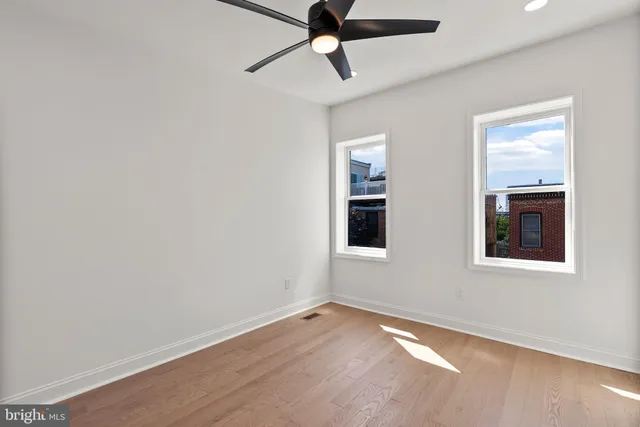 a view of balcony with wooden floor