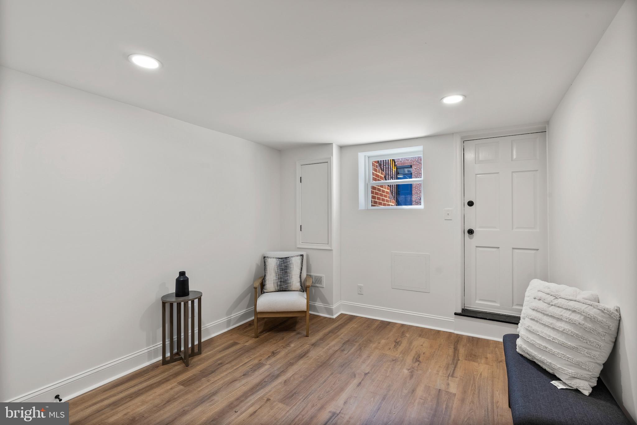 1523 Clarkson Street Baltimore, MD 21230 - Photo 45 of 57 a living room with furniture and a wooden floor