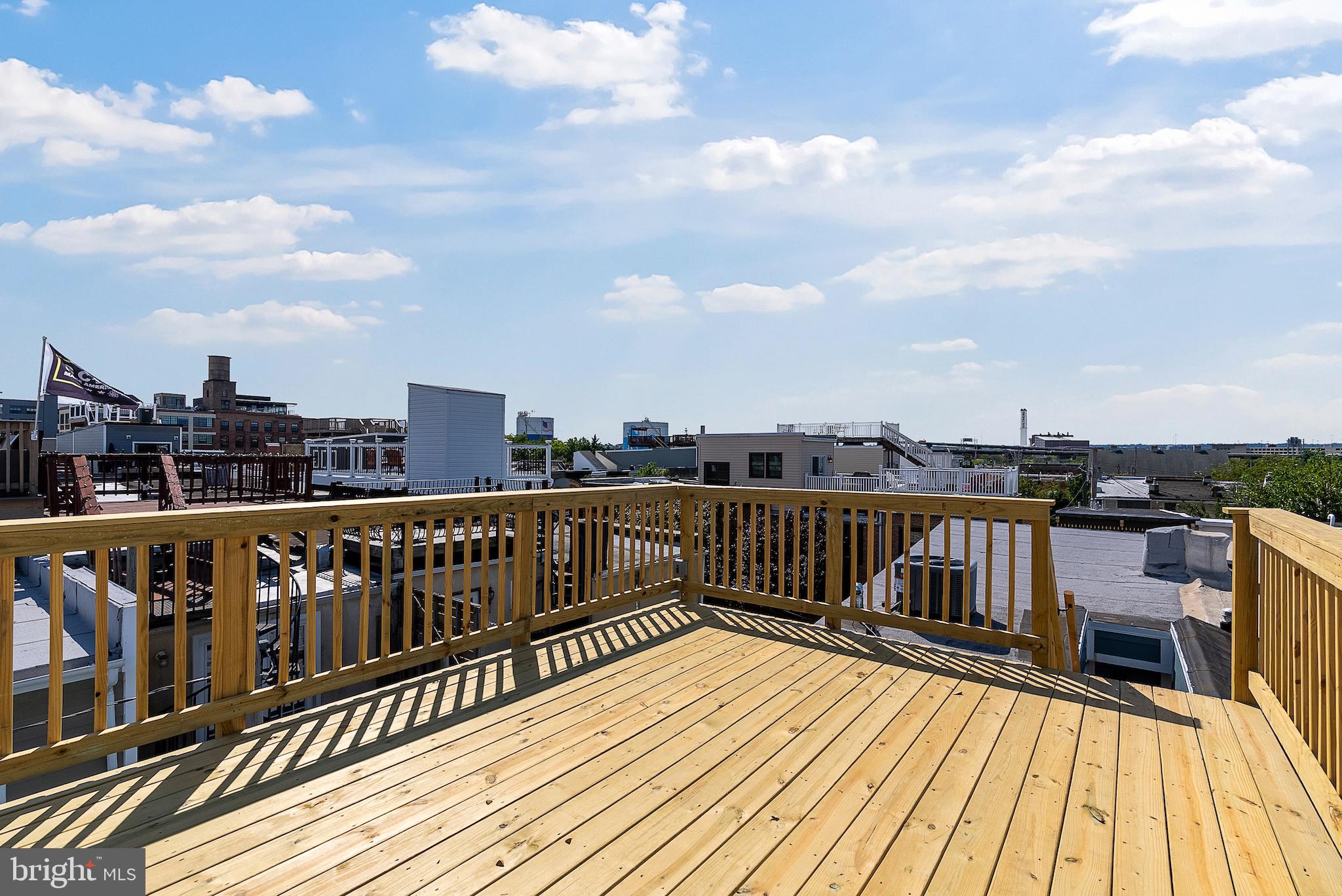 1523 Clarkson Street Baltimore, MD 21230 - Photo 46 of 57 a balcony with wooden floor