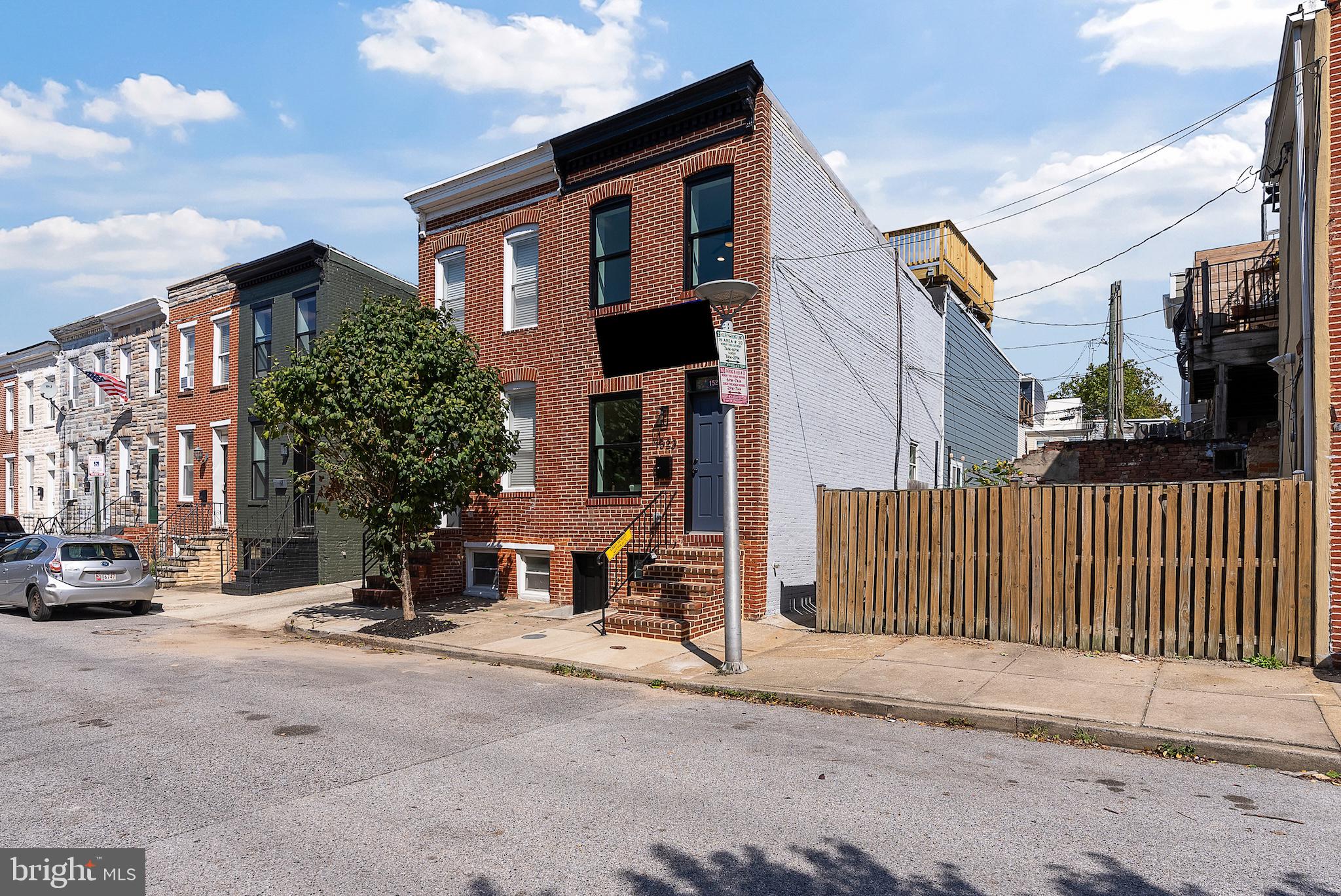 1523 Clarkson Street Baltimore, MD 21230 - Photo 6 of 57 a view of a street with cars
