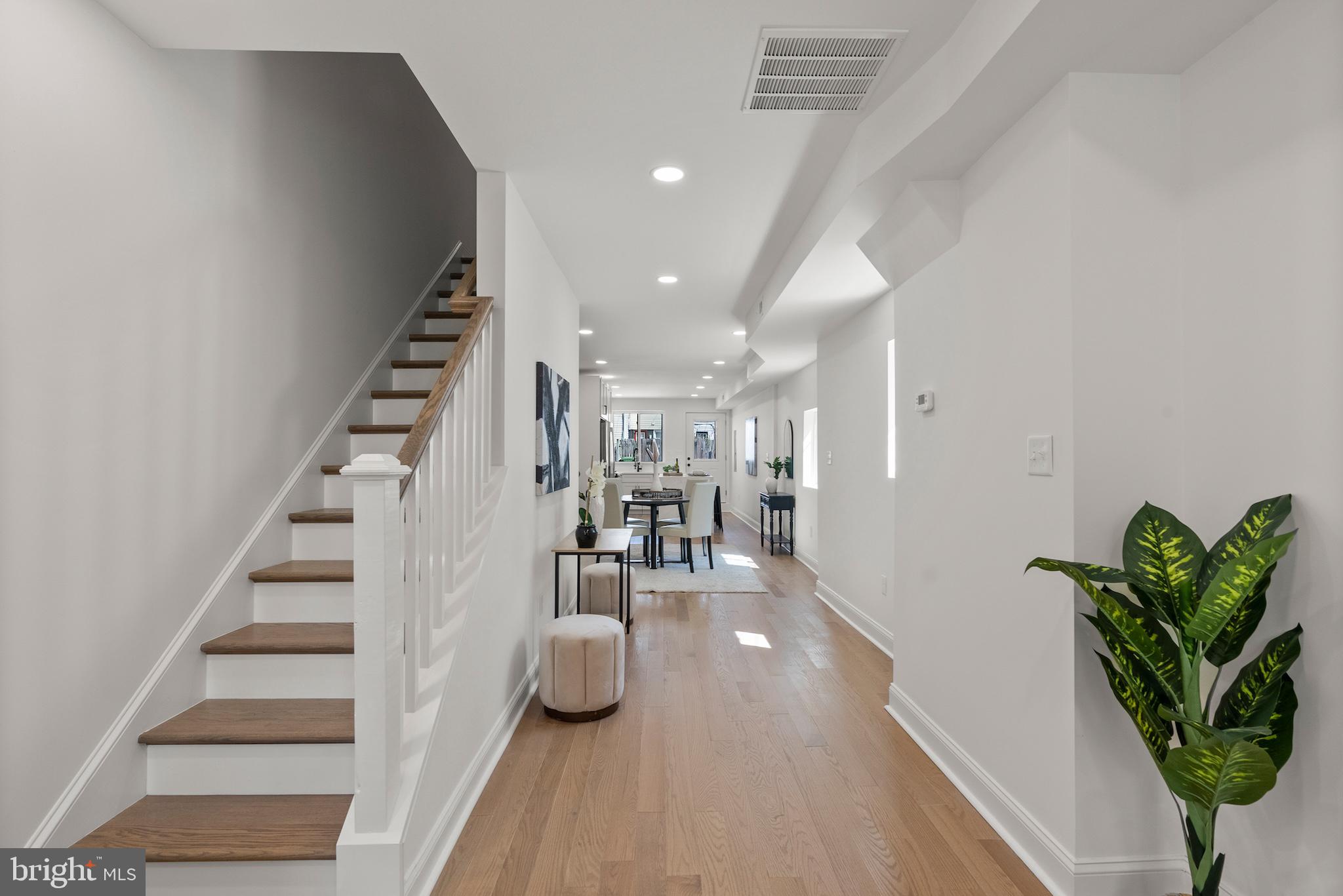 1523 Clarkson Street Baltimore, MD 21230 - Photo 7 of 57 a view of entryway and hall with wooden floor