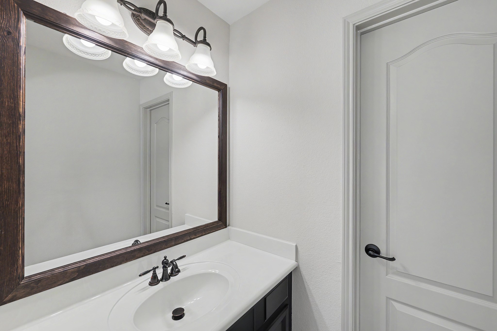 2714 Nickel Canyon Drive Rosharon, TX 77583 - Photo 23 of 31 a bathroom with a sink and a mirror