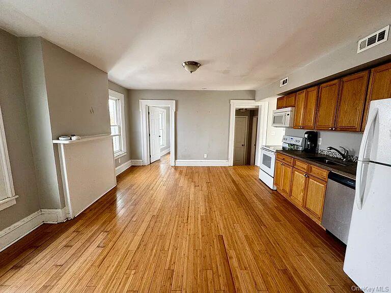 9 South Clinton Street, Unit 2 Poughkeepsie, NY 12601 - Photo 3 of 10 a view of kitchen with sink and refrigerator