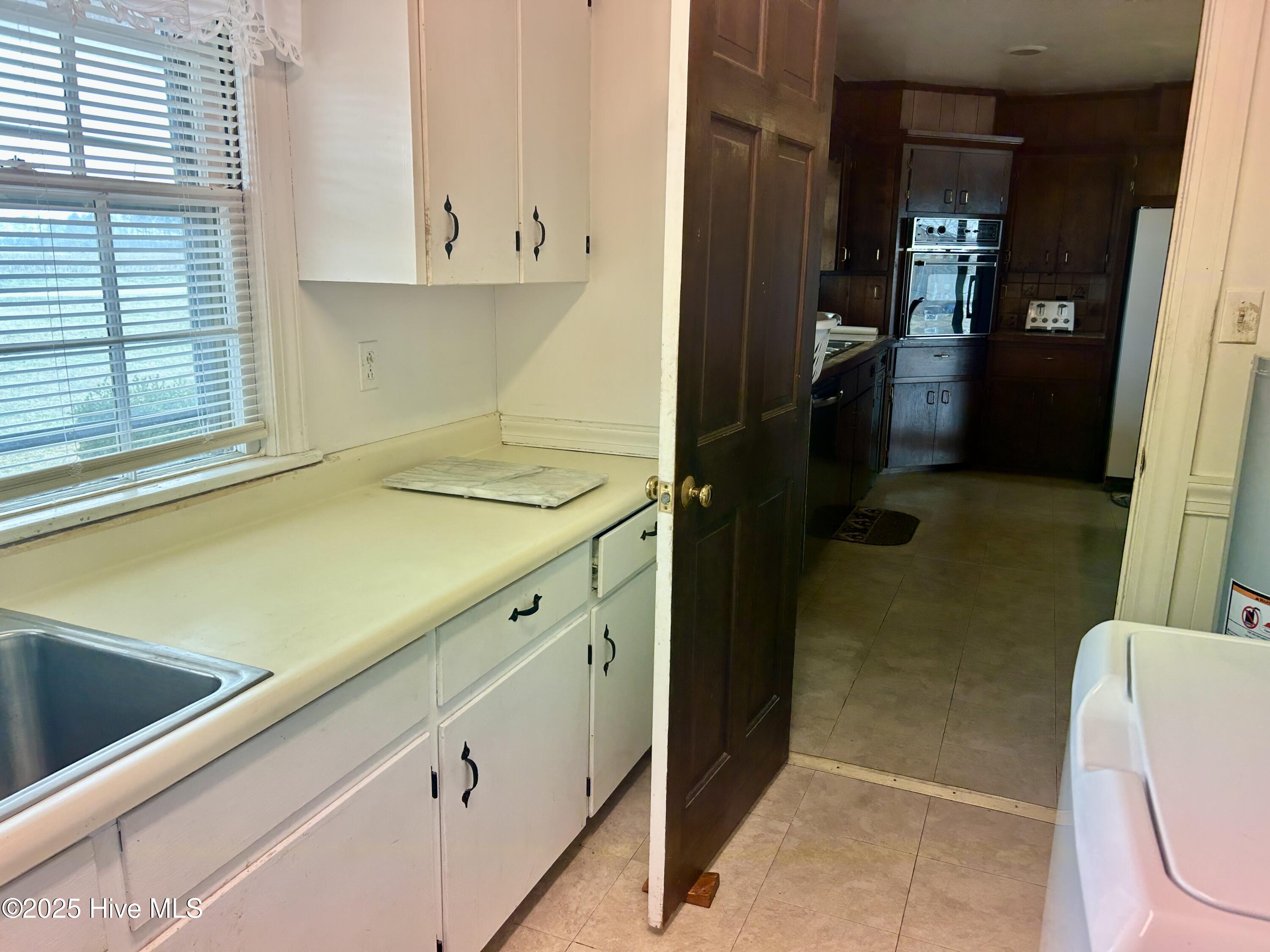 1125 Kehukee Church Road Scotland Neck, NC 27874 - Photo 27 of 49 laundry room looking into kitchen