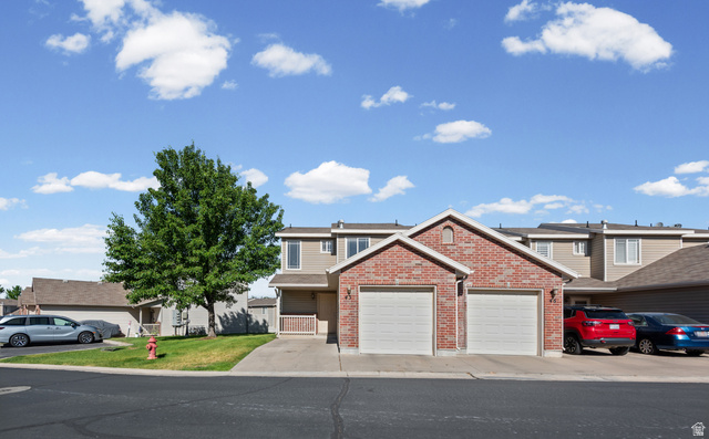 652 West 800 North, Unit 45 Clinton, UT 84015 - Photo 3 of 17 Brick-front townhouse with twin garages