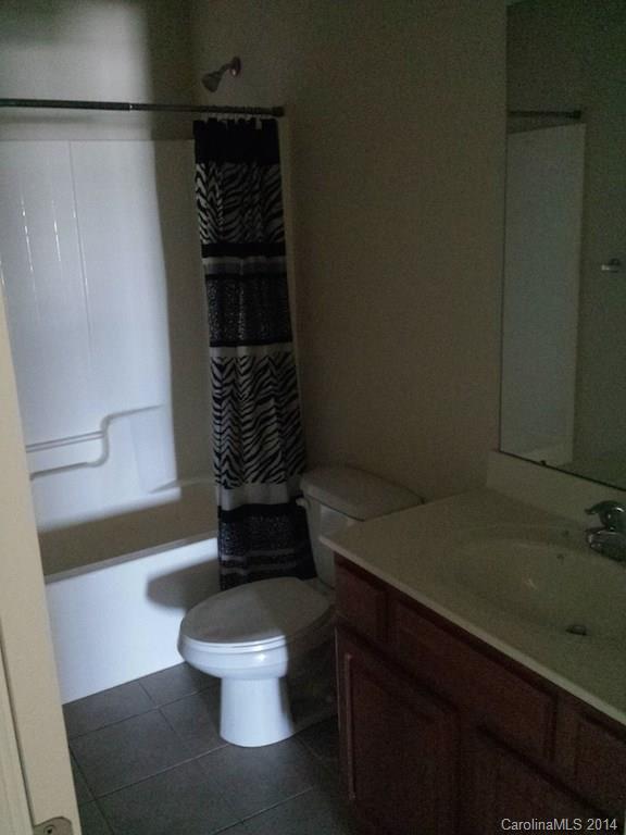 4084 Clover Road Northwest Concord, NC 28027 - Photo 12 of 17 a bathroom with a sink and a toilet