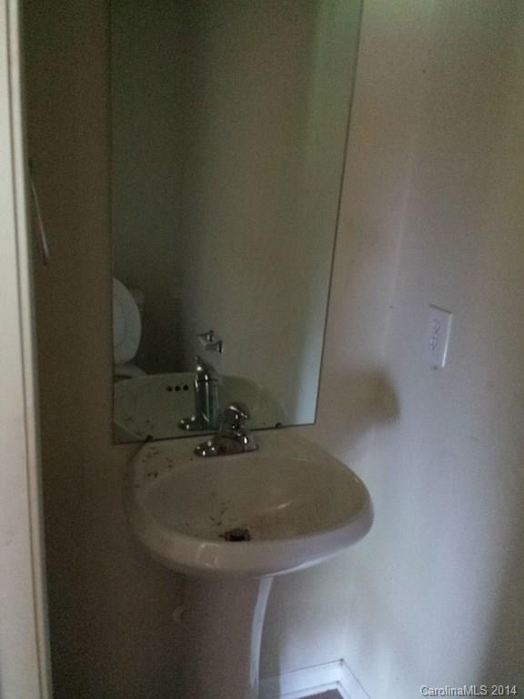 4084 Clover Road Northwest Concord, NC 28027 - Photo 15 of 17 a bathroom with a sink and a mirror
