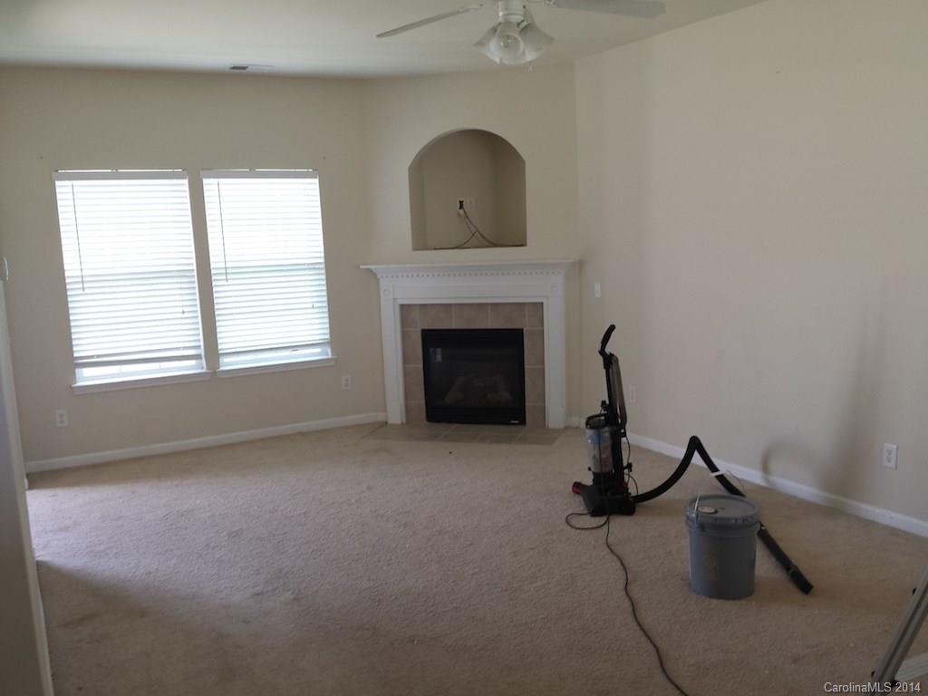 4084 Clover Road Northwest Concord, NC 28027 - Photo 5 of 17 a living room with furniture and a fireplace