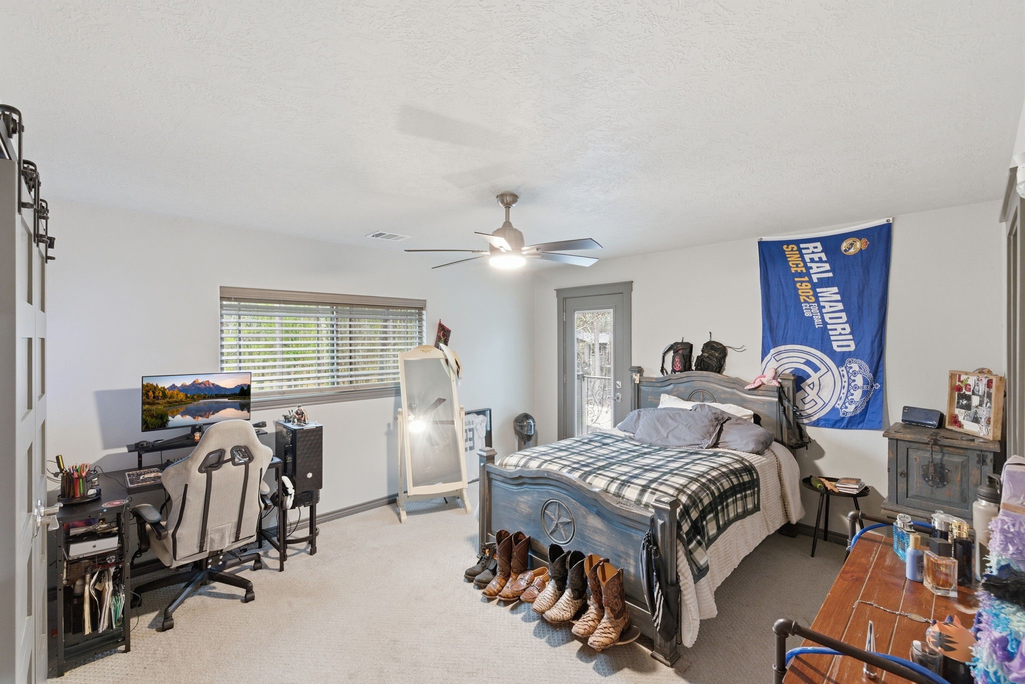 1480 Traylor Road Conroe, TX 77304 - Photo 13 of 25 a bedroom with furniture and a gym equipment