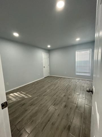 8612 10th Street Lubbock, TX 79416 - Photo 8 of 10 an empty room with wooden floor and windows