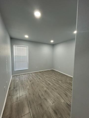 8612 10th Street Lubbock, TX 79416 - Photo 9 of 10 an empty room with wooden floor and windows