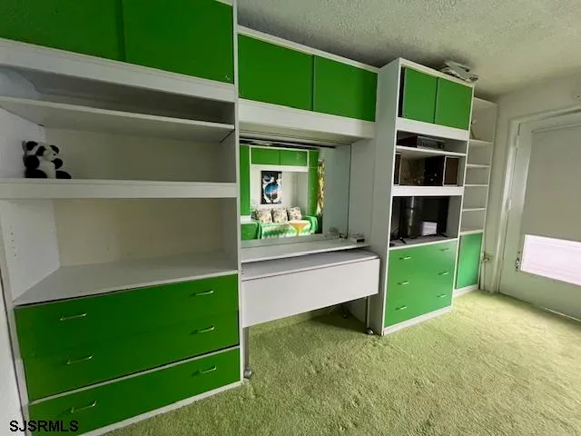 a room with cabinets and a fireplace