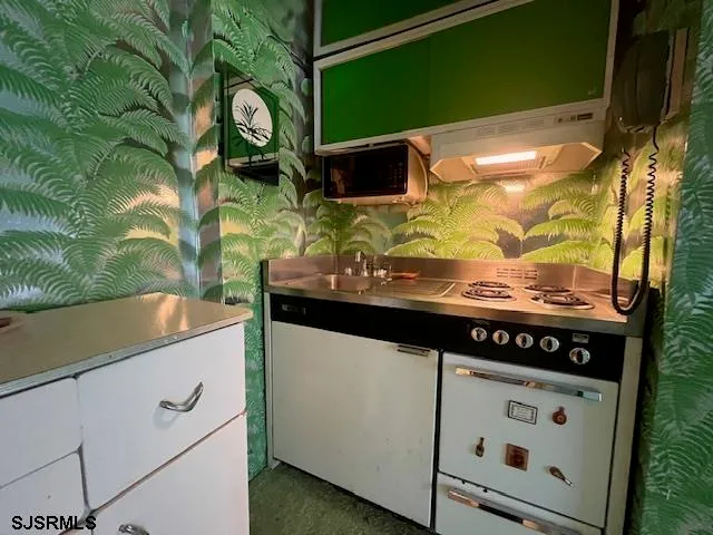 a utility room with cabinets