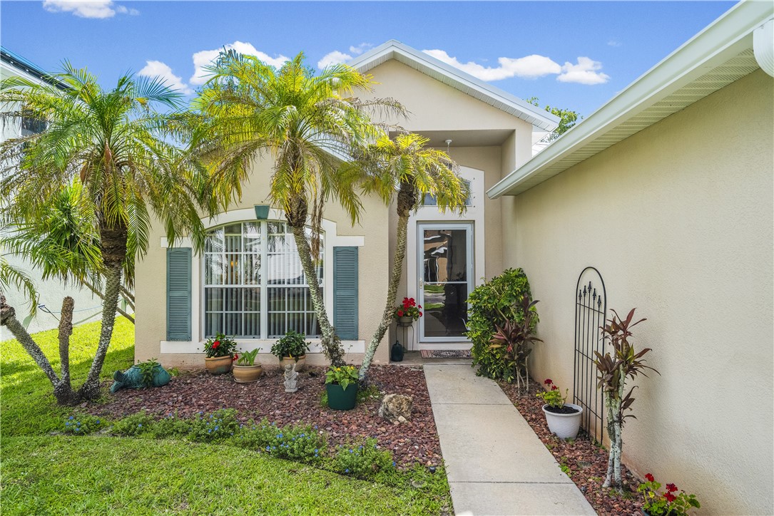131 Bellamy Trail Sebastian, FL 32958 - Photo 25 of 32 a front view of a house with garden
