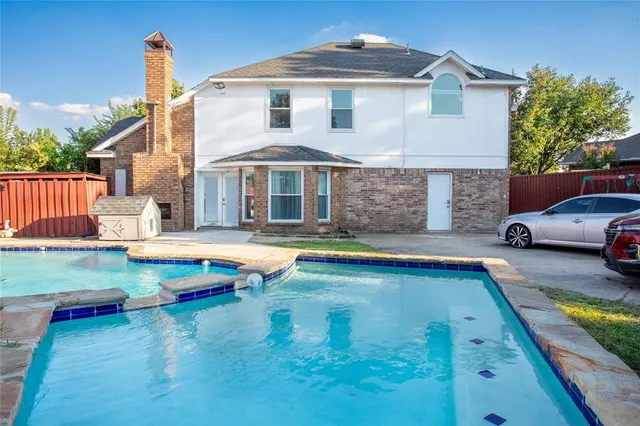 a view of swimming pool with seating space