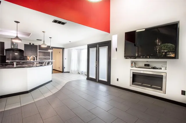 a kitchen with stainless steel appliances a stove a microwave and a refrigerator