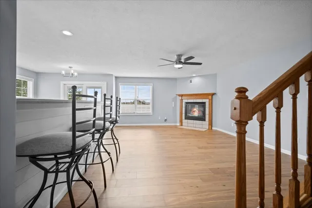 a view of a livingroom with furniture and hardwood floor