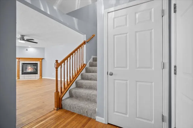 a view of a hallway with wooden floor and entryway
