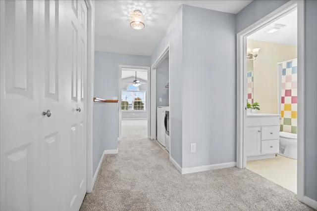 an empty room with chandelier fan