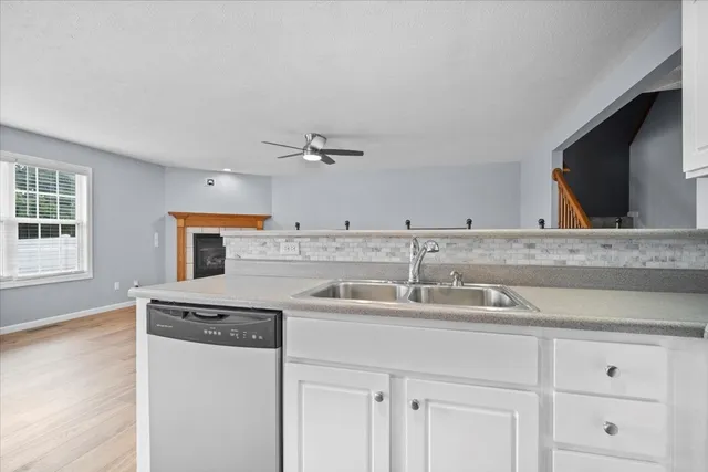 a utility room with cabinets washer and dryer