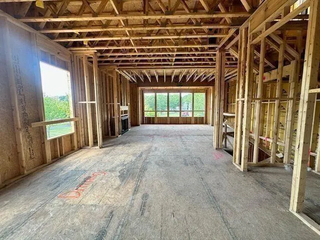 a view of an empty room with a fireplace